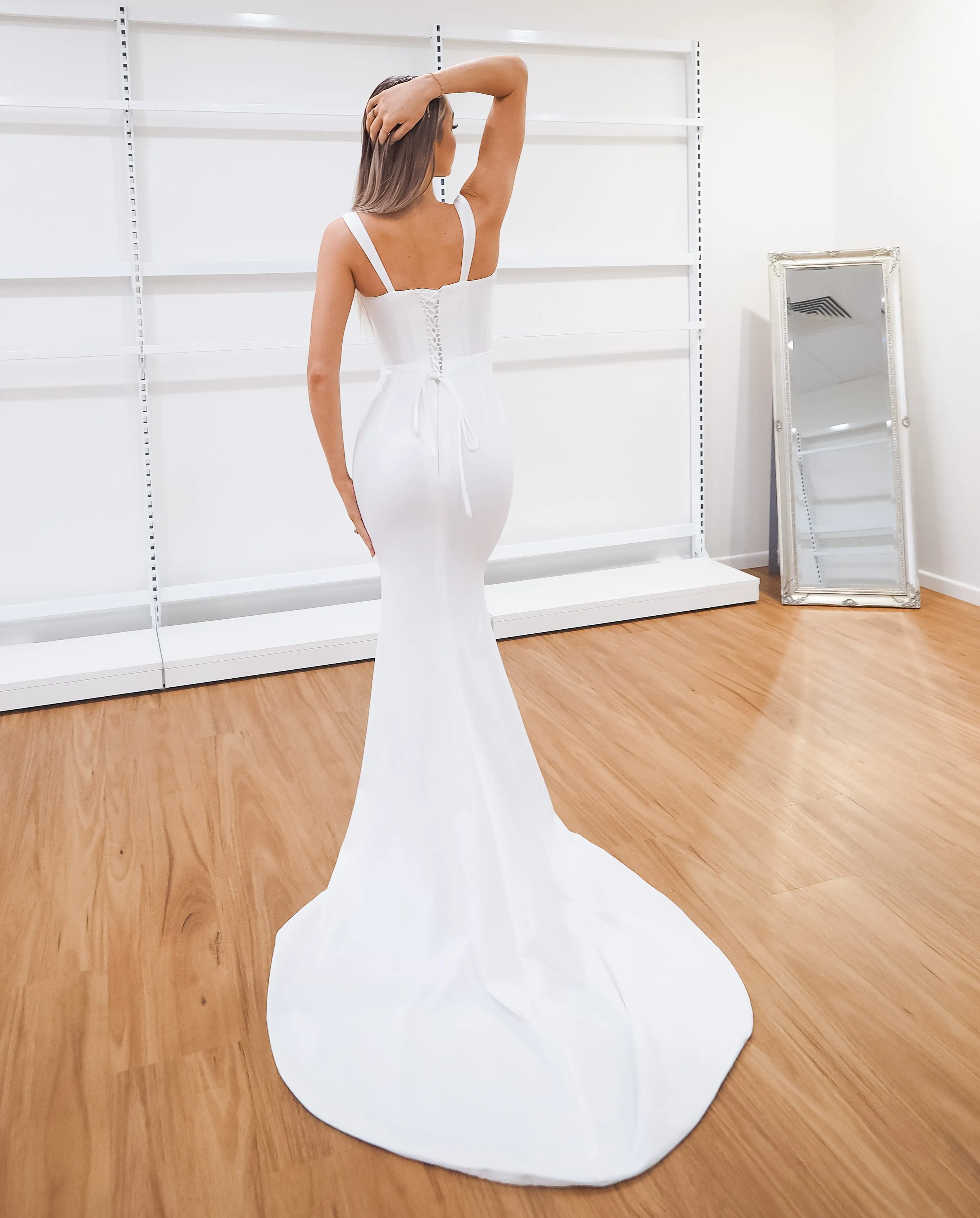 White bustier mermaid dress with lace up back for hire