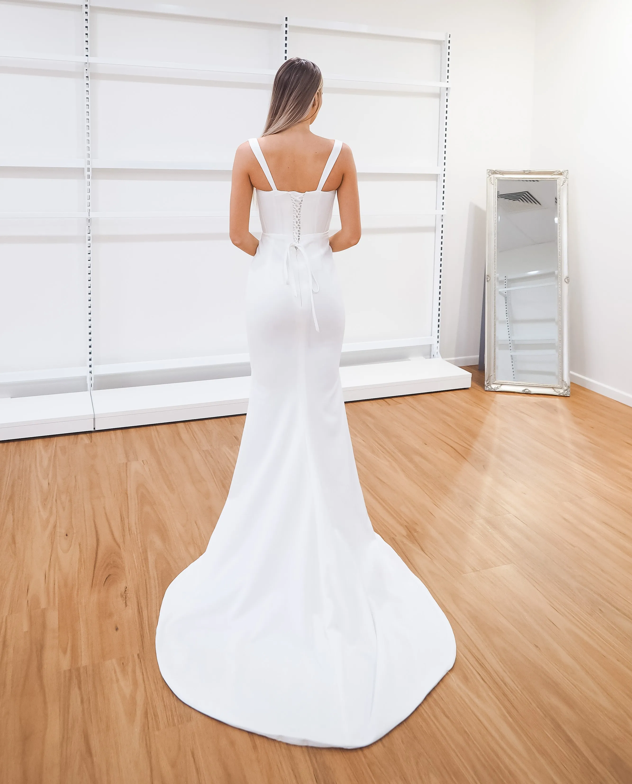 White bustier mermaid dress with lace up back for hire