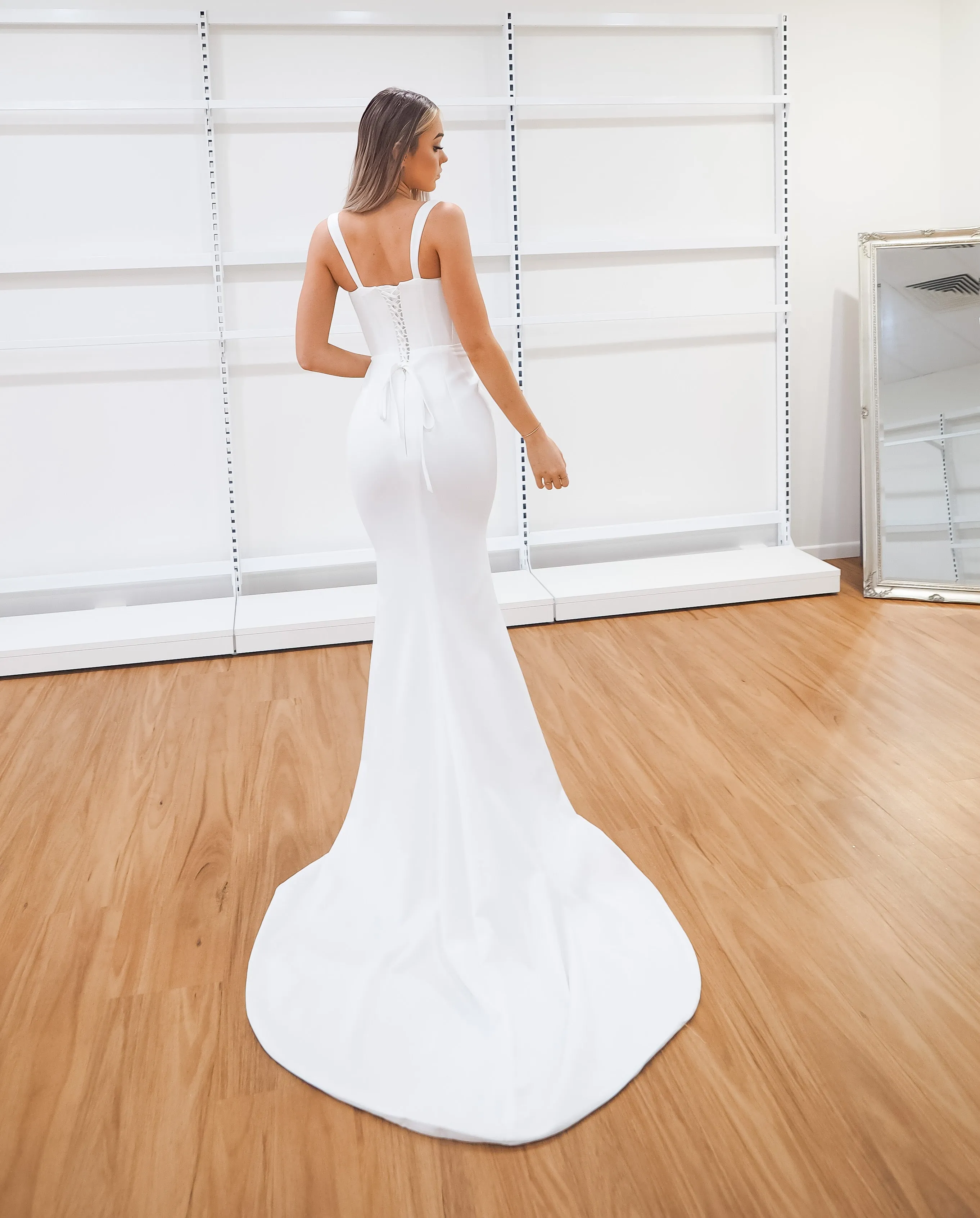 White bustier mermaid dress with lace up back for hire