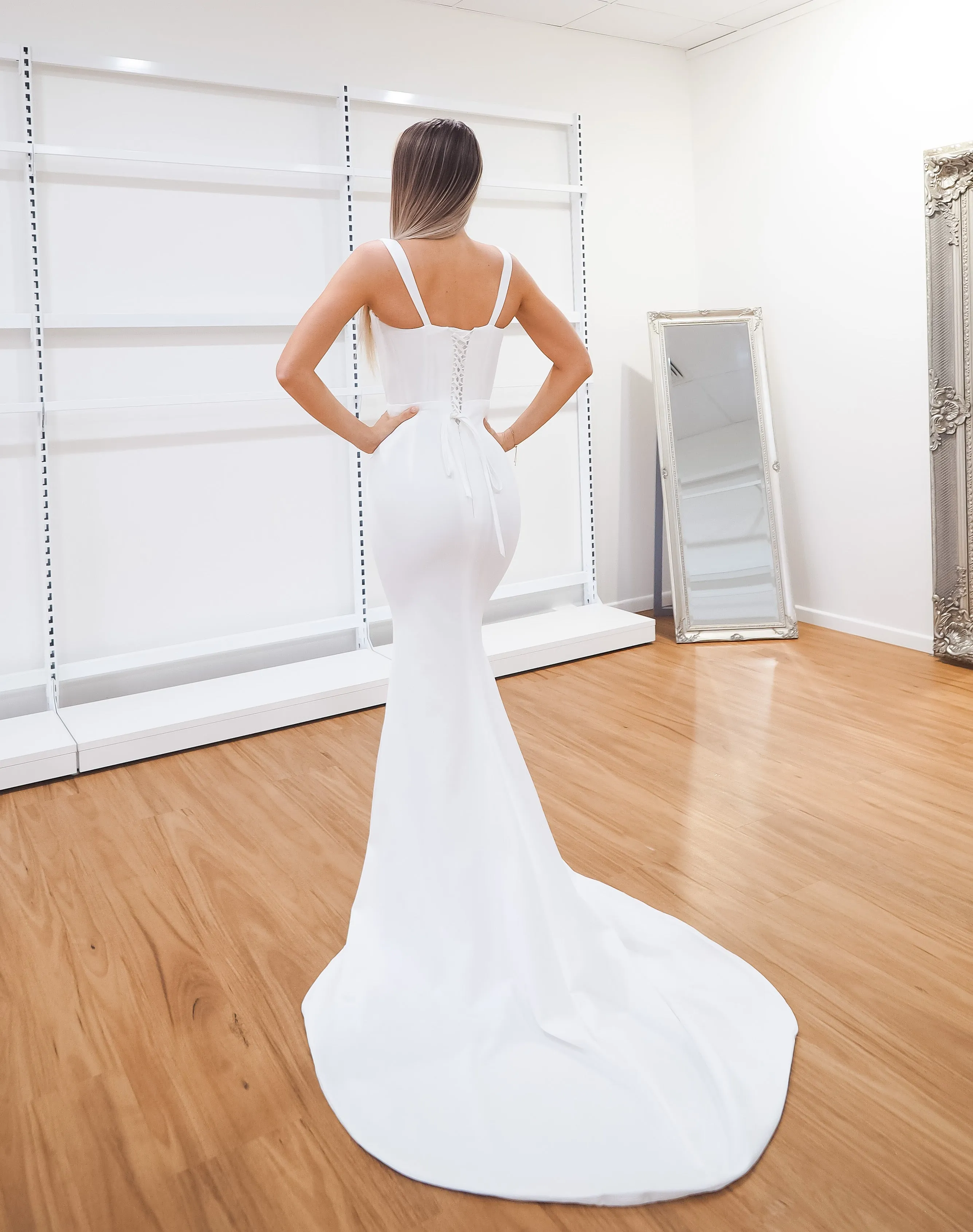 White bustier mermaid dress with lace up back for hire
