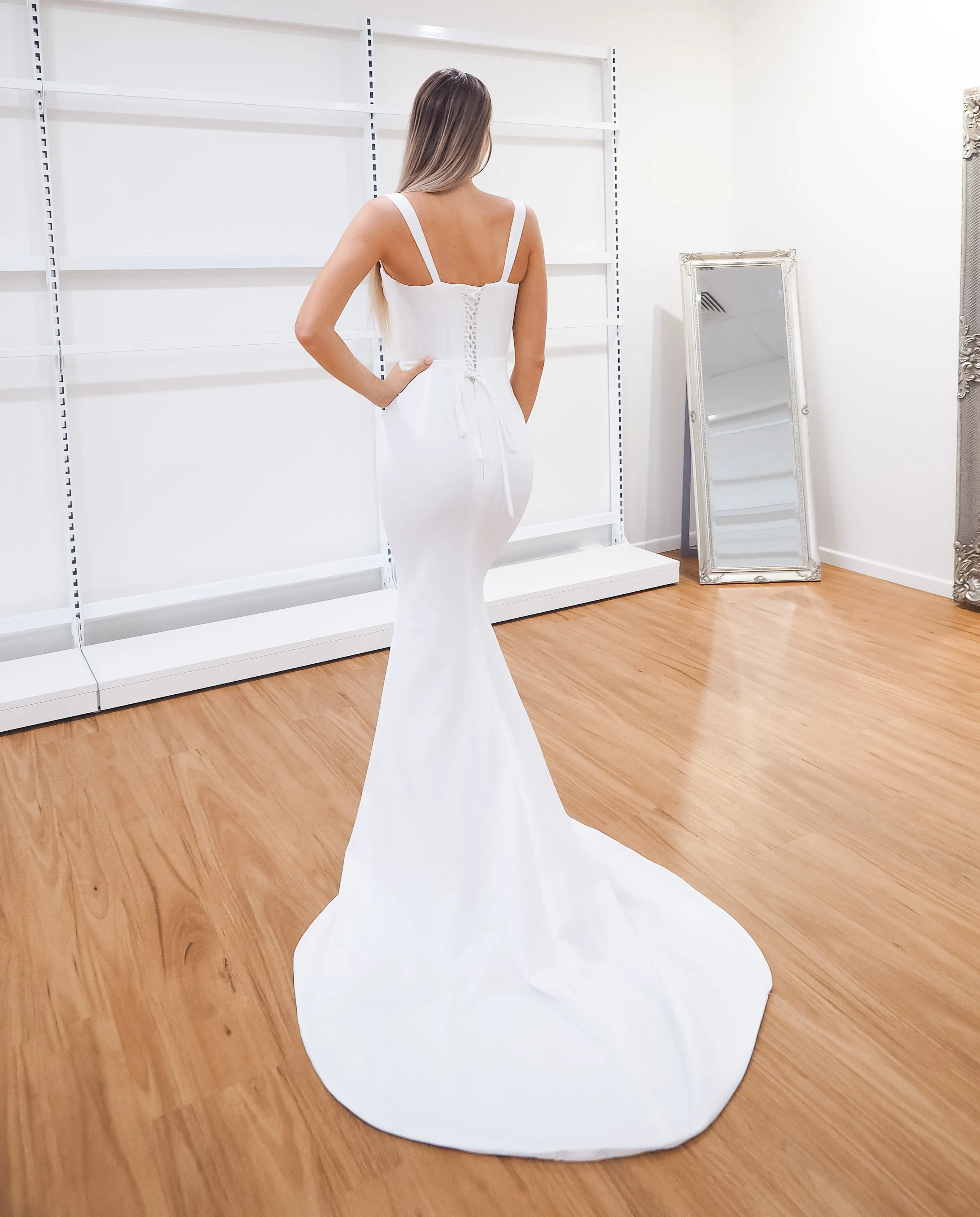 White bustier mermaid dress with lace up back for hire